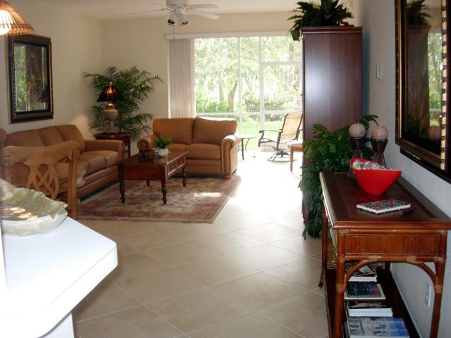 Living room, with rear lanai in background